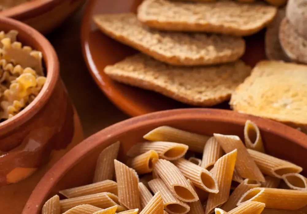 A table full of carbs like pasta and bread